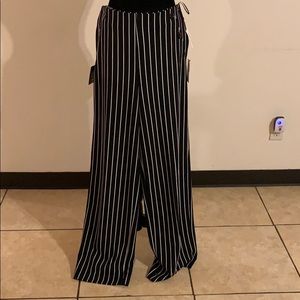 Black wide leg pants with white pin stripes